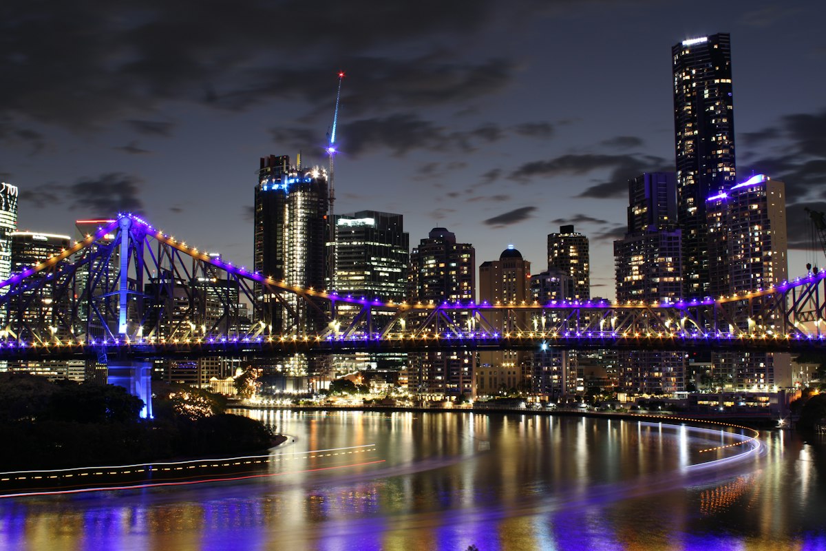 Story Bridge and Brisbane CBD lights reflecting on the river at night
